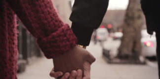 Black couple holding Hands